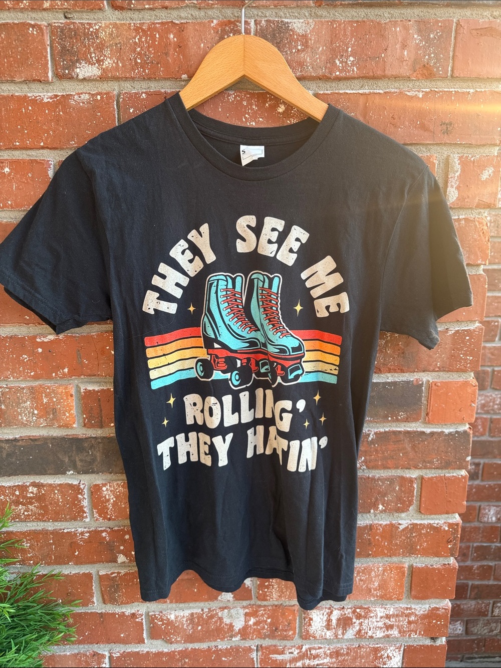 Black Graphic Tee with Retro Roller Skates